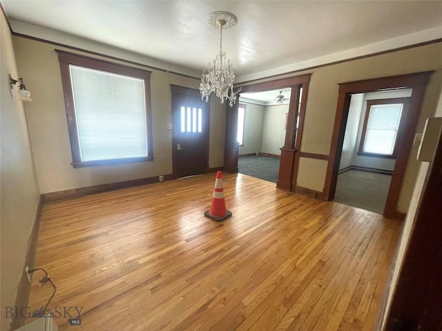 512 W Park, Anaconda, MT 59711 - unfurnished dining area with hardwood / wood-style floors, baseboards, and a notable chandelier