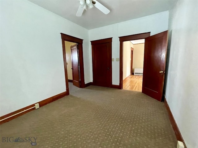 512 W Park, Anaconda, MT 59711 - unfurnished bedroom with a ceiling fan, baseboards, a closet, and carpet flooring