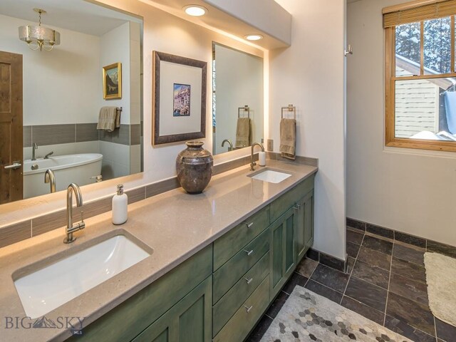 bathroom with a tub to relax in, tile patterned floors, and double vanity