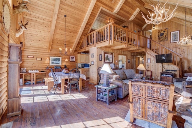 54 Torry Rd, Cameron, MT 59720 - living room with a chandelier, high vaulted ceiling, wood ceiling, beamed ceiling, and wood walls