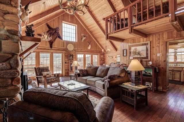 54 Torry Rd, Cameron, MT 59720 - living area with wood ceiling, a chandelier, high vaulted ceiling, wood walls, and dark wood finished floors