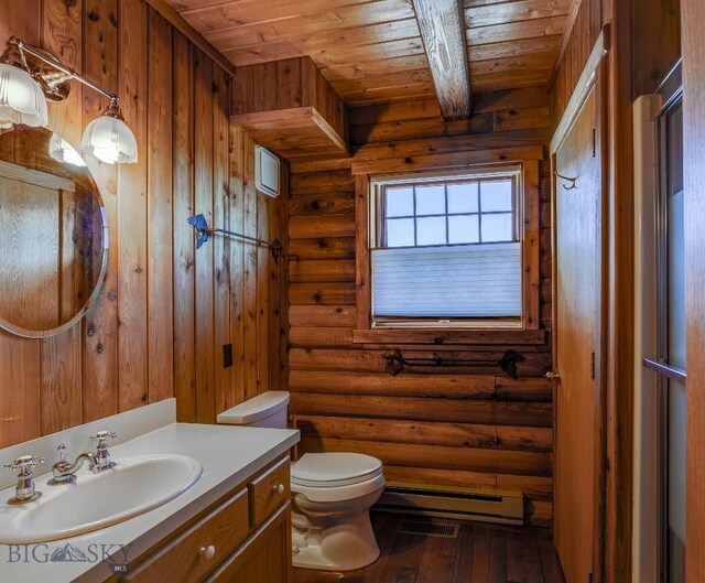 54 Torry Rd, Cameron, MT 59720 - bathroom with wood ceiling, a baseboard heating unit, toilet, wood-type flooring, and vanity
