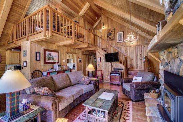 54 Torry Rd, Cameron, MT 59720 - living room with wood walls, high vaulted ceiling, a chandelier, wooden ceiling, and stairway
