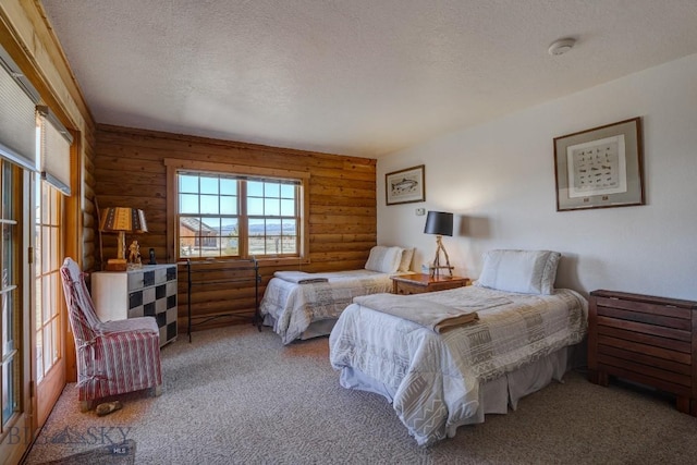 54 Torry Rd, Cameron, MT 59720 - carpeted bedroom with a textured ceiling and rustic walls