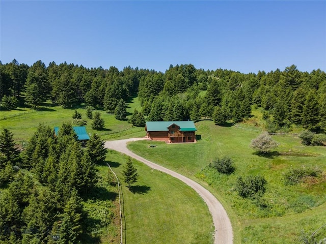 birds eye view of property with a rural view