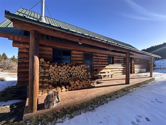 72 Sky Band Trl, Livingston, MT 59047 - view of home's exterior with metal roof and an exterior structure