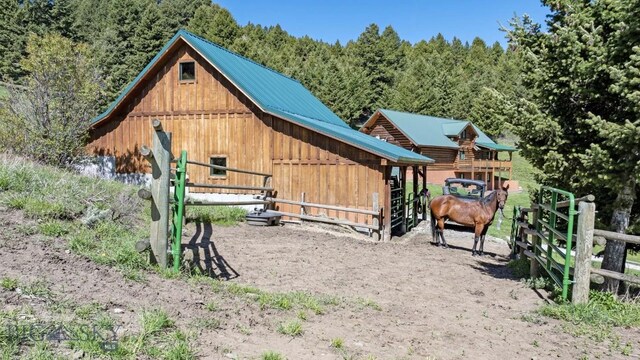 view of playground featuring an outbuilding