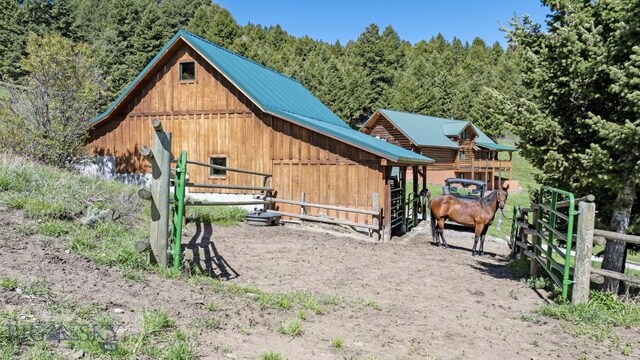 72 Sky Band Trl, Livingston, MT 59047 - surrounding community with an outbuilding, an exterior structure, and a view of trees