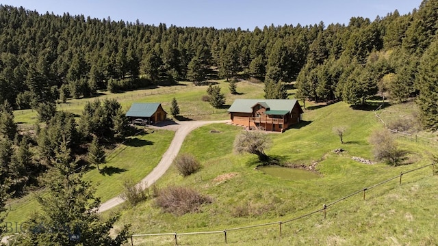 birds eye view of property with a rural view