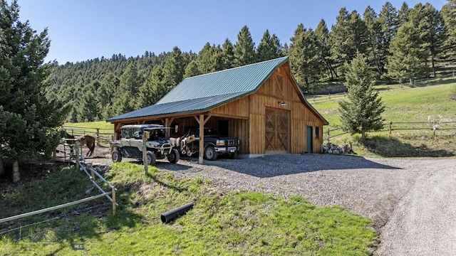 view of outdoor structure with a rural view