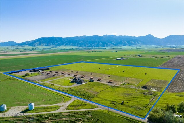 birds eye view of property with a rural view and a mountain view