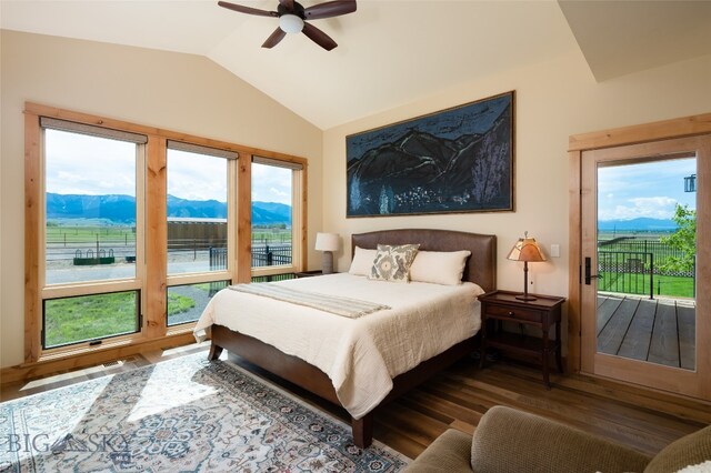 bedroom with multiple windows, dark hardwood / wood-style flooring, ceiling fan, and lofted ceiling