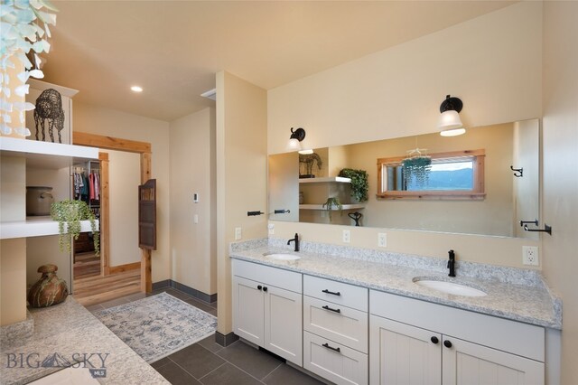 bathroom with tile flooring and double sink vanity