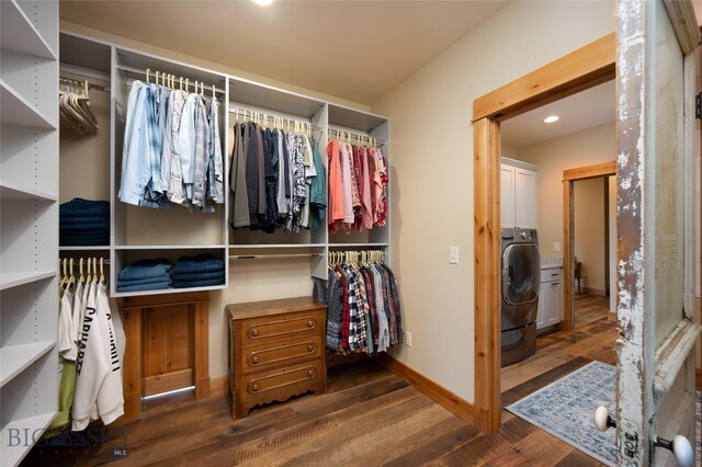 walk in closet featuring dark wood-type flooring and washer / clothes dryer