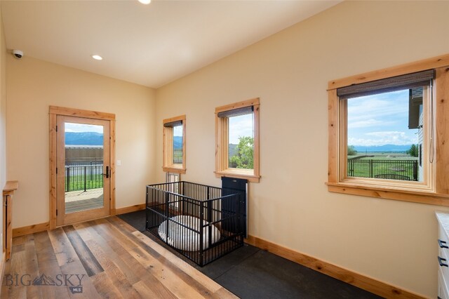 spare room with dark hardwood / wood-style floors