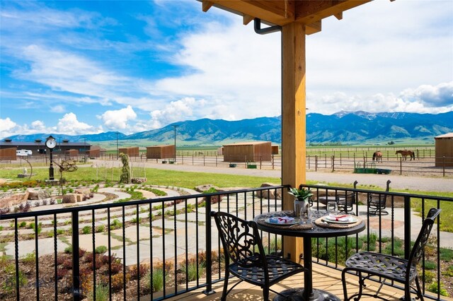 balcony featuring a mountain view