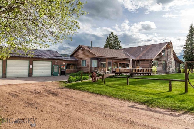 cabin with a front yard