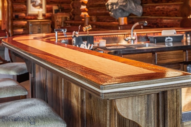 bar with log walls and sink