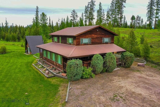 log-style house featuring a front lawn