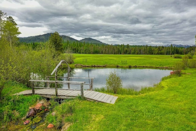 dock area featuring a water and mountain view