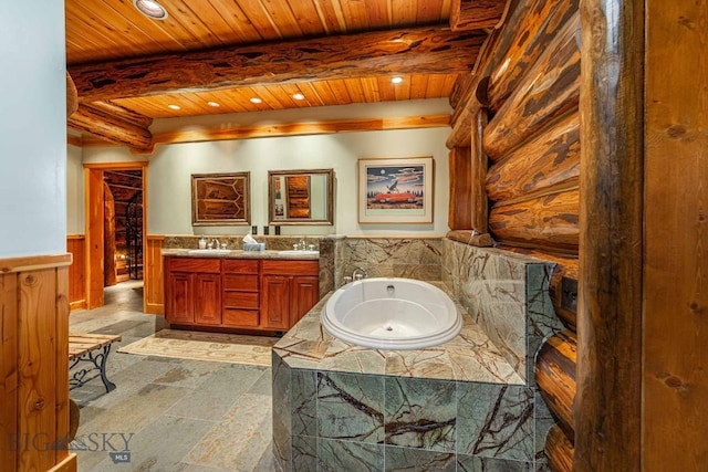 bathroom featuring beamed ceiling, wooden ceiling, vanity, and a washtub