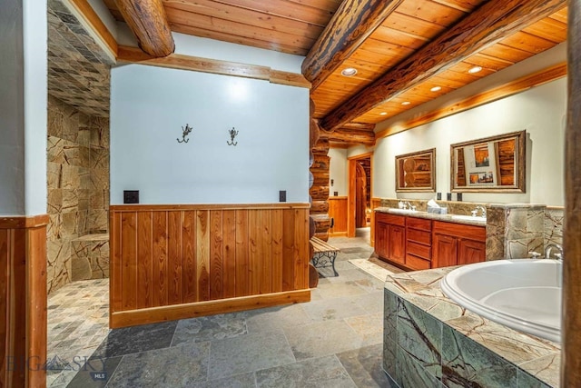 bathroom featuring wooden ceiling, tile flooring, vanity, beamed ceiling, and a tub