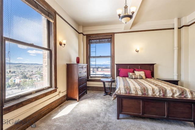 bedroom featuring carpet floors and a chandelier