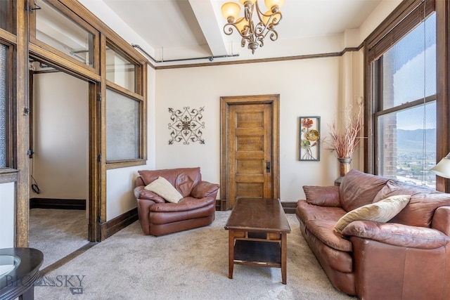 living room with a chandelier and carpet floors