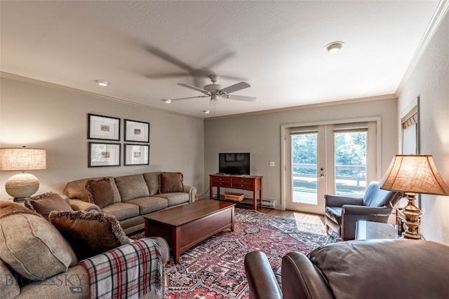 living room featuring ornamental molding, wood-type flooring, ceiling fan, and french doors