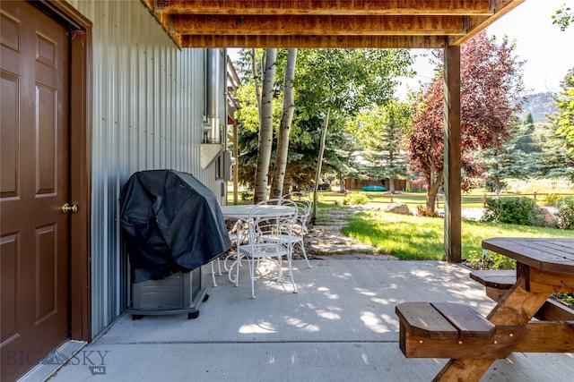 view of patio featuring a grill