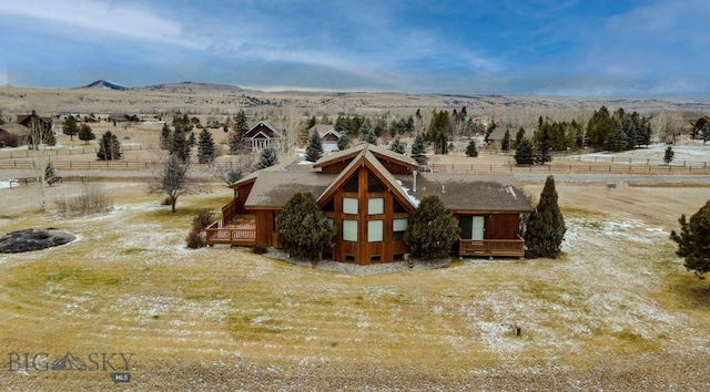 birds eye view of property with a mountain view and a rural view