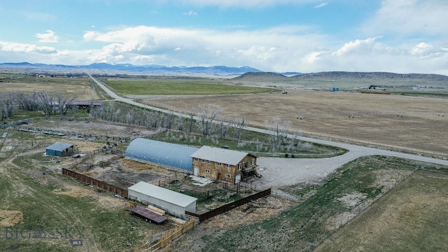 bird's eye view featuring a rural view and a mountain view