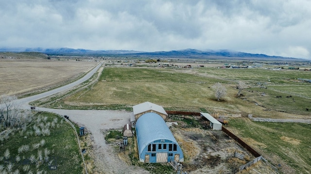 aerial view with a mountain view and a rural view