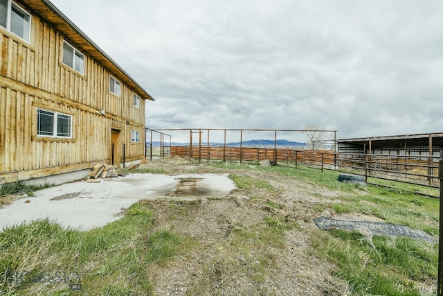 view of yard with a rural view