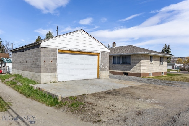 view of front of property with an outbuilding and a garage