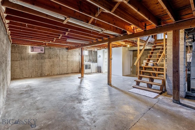 basement with washing machine and clothes dryer