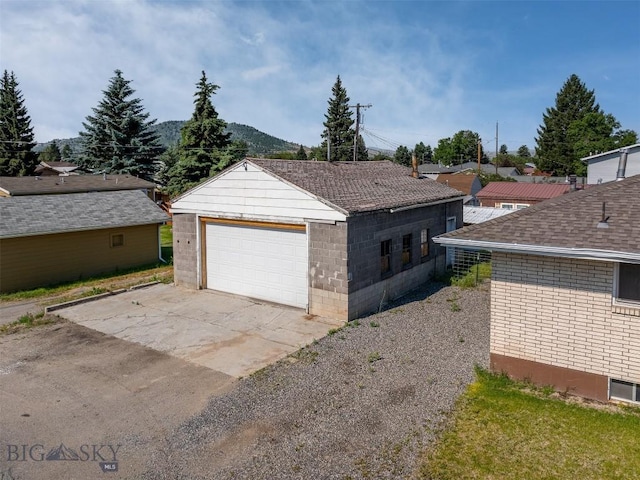 exterior space with a garage and an outdoor structure