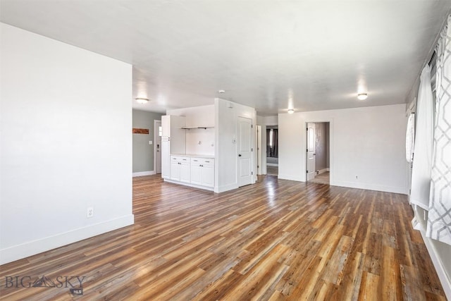 unfurnished living room with hardwood / wood-style floors