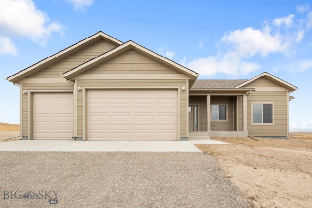 ranch-style house featuring a garage