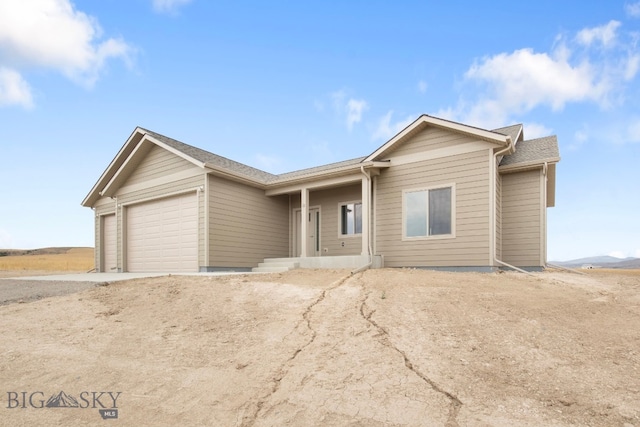 ranch-style home featuring a garage