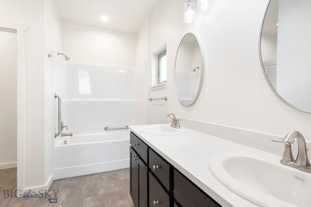 bathroom with vanity and wood-type flooring