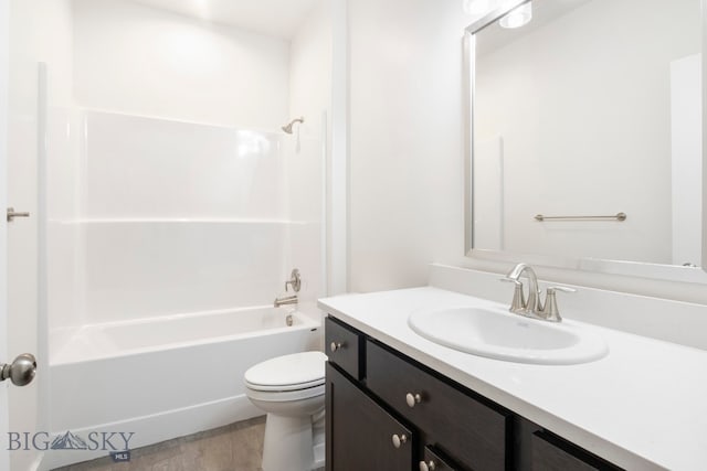 full bathroom featuring shower / bathing tub combination, vanity, and toilet