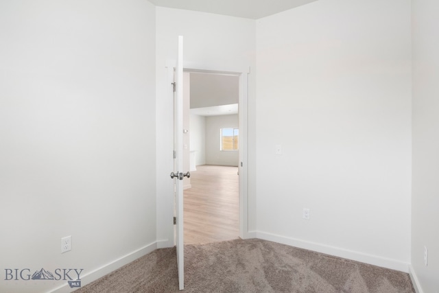 interior space featuring light colored carpet