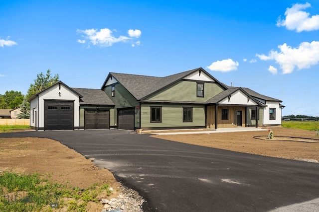 view of front of home with a garage and a porch