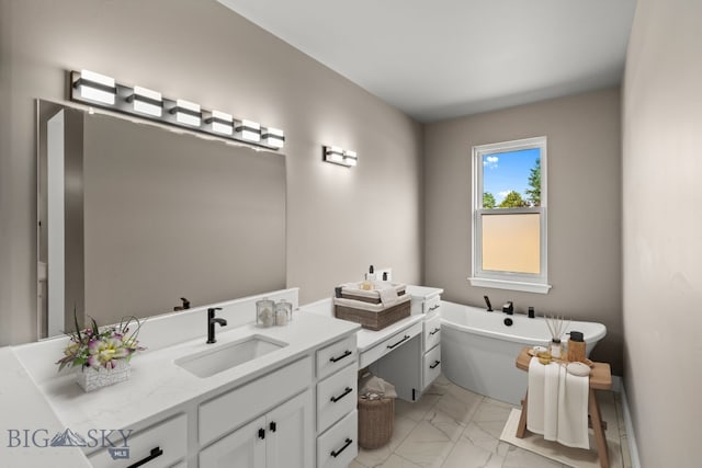 bathroom with a tub to relax in and vanity