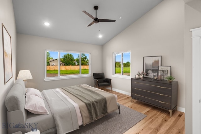 bedroom with baseboards, a ceiling fan, light wood-style flooring, high vaulted ceiling, and recessed lighting