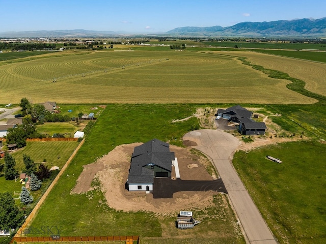 drone / aerial view featuring a mountain view and a rural view