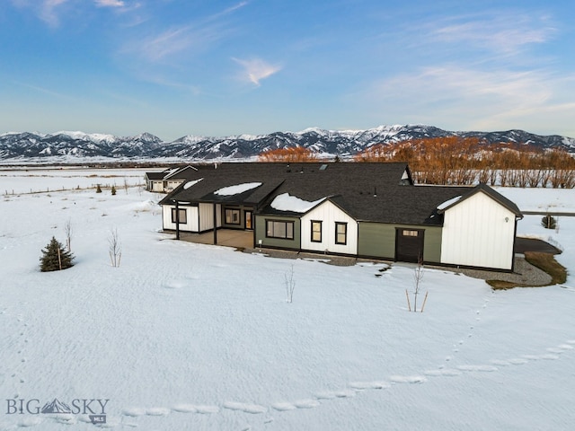 view of front of house with a mountain view and board and batten siding