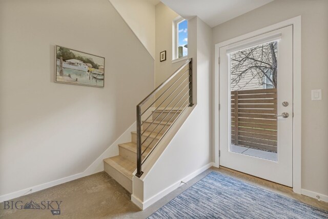 interior space featuring a healthy amount of sunlight and carpet