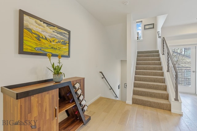 stairs with light wood-type flooring